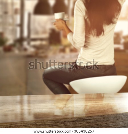 interior of kitchen and woman on chair
