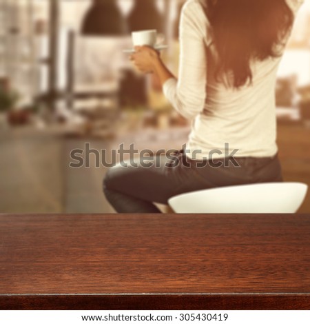 dark glasses top of brown color and woman on chair