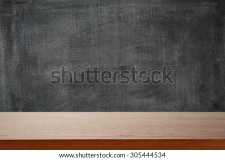 dark background of black board and dark brown desk space for you