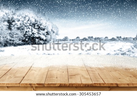 landscape of trees snow blue sky and snow on board