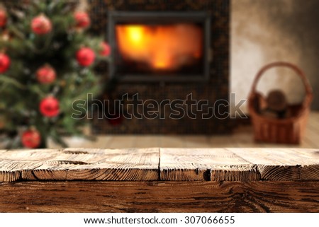 dirty wooden desk top place and fire in fireplace