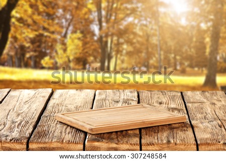 autumn landscape of golden colors of trees in park and kitchen desk and table