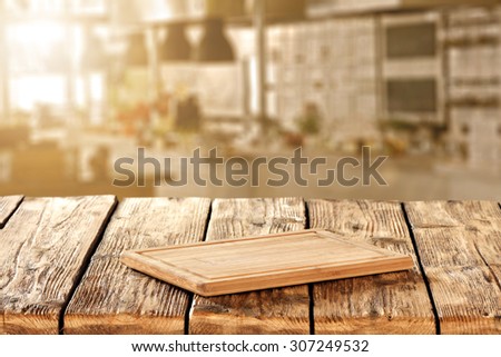 blurred background of kitchen of sun light and kitchen desk on table