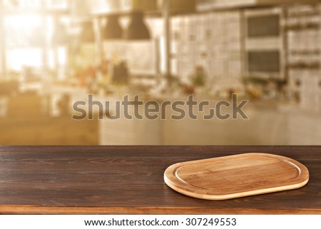 blurred background of kitchen of sun light and wooden desk space