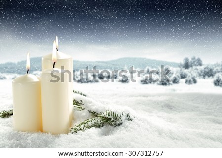 decoration of three candles and xmas time and white cold snow decoration