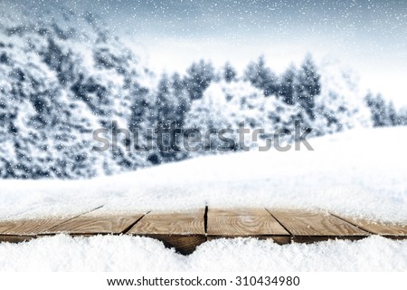 blurred background of winter and winter big table and snow