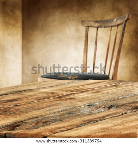 worn wooden table and chair