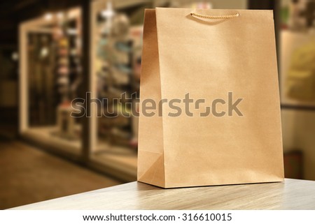 big paper bag in the background of a shop window