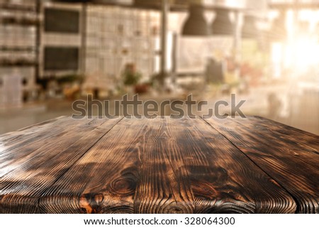 sun in interior of kitchen and dark desk board of wood