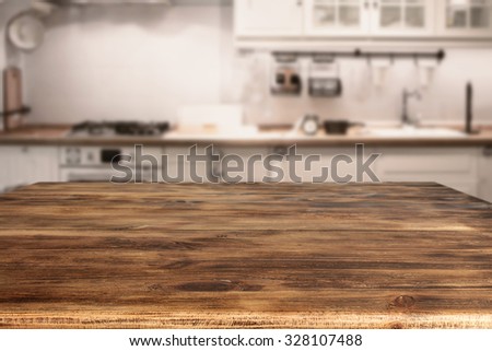blurred background of kitchen furniture and wooden table