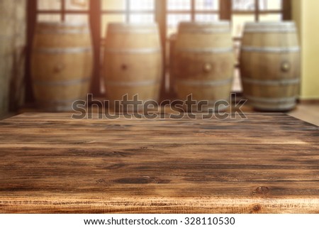 interior of sun light with few barrels and desk top place