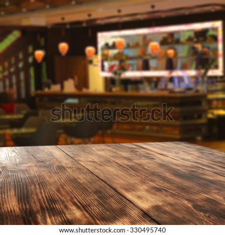 blurred background of bar and wooden board