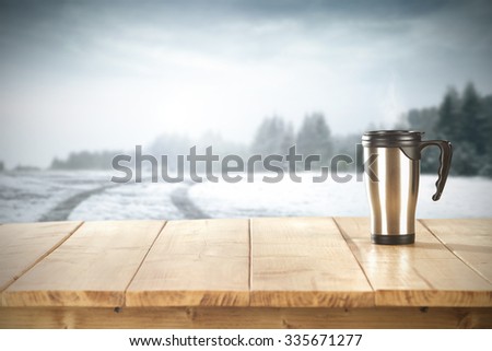 wooden yellow desk space and green mug