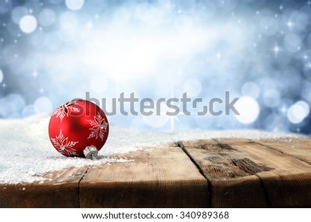 xmas blue wall wooden retro table snow and red ball place