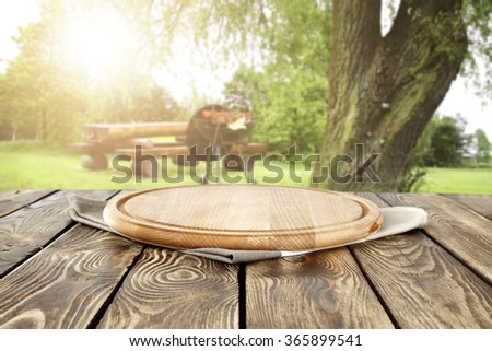 blurred background of grill time and summer wooden desk top  place
