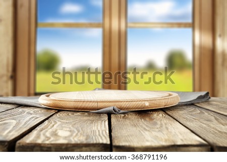blurred background of brown wooden window space and morning time and wooden kitchen desk