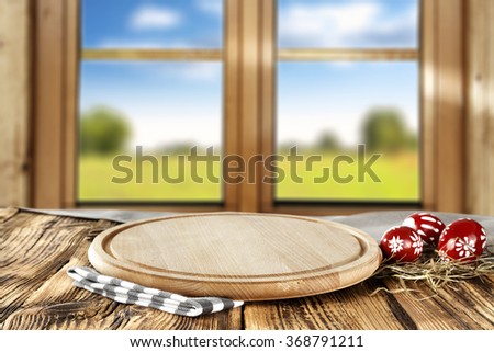 blurred background of brown wooden window space and eggs and window sill