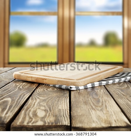 blurred background of brown wooden window space and brown wooden table and yellow wooden desk top place