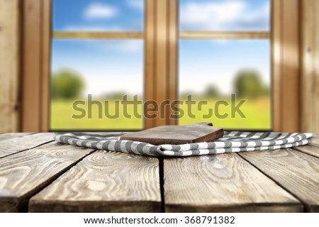 blurred background of brown wooden window space and dark wooden desk wooden dark table and free space for your decoration