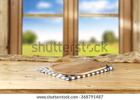 blurred background of brown wooden window space and napkin wooden desk space and free space for you