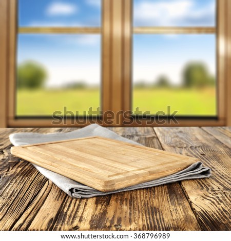 spring wooden window space in blurred background and board of food space