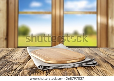 spring wooden window space in blurred background and gray wooden napkin and wooden decoration for you