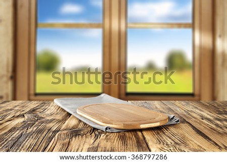 spring wooden window space in blurred background and shabby wooden table and space for you