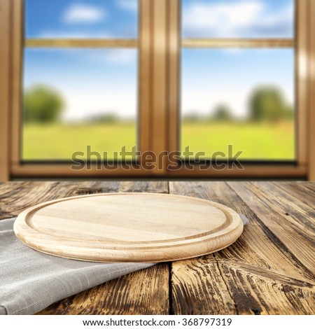 spring wooden window space in blurred background and yellow wooden space and tablecloth and shabby top