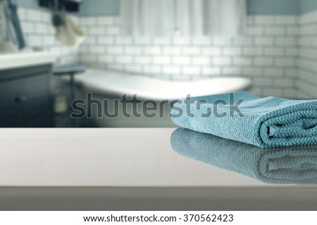 blue blurred background of bathroom interior with towel