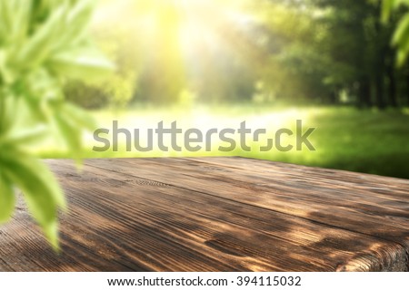board of wood in brown color and green leaves