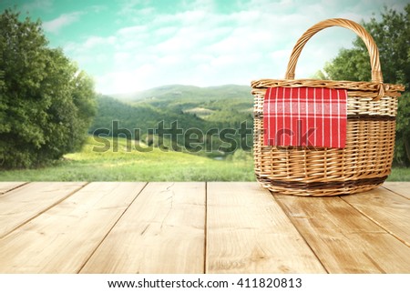 rural landscape and picnic basket and summer time