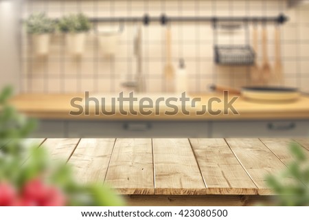 interior of kitchen and desk and leaves