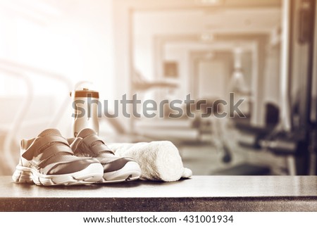 gym interior with retro effect and shoes and towel