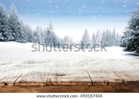 dirty old wooden table place of snow and trees of snow place