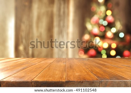 retro interior with xmas tree and wooden old table place