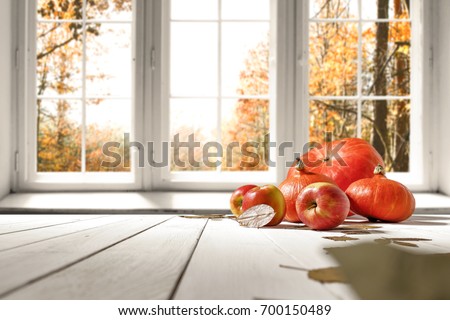 Autumn white kitchen with big orange pumpkin