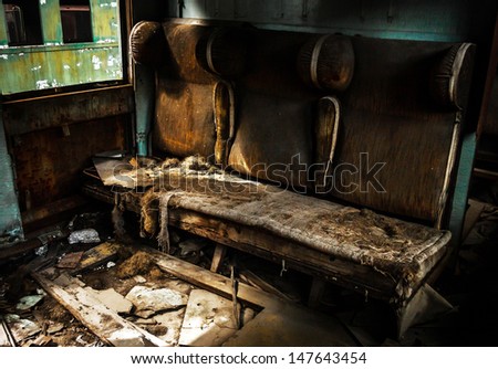 Abandoned carriage interior with seats closeup