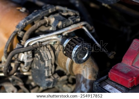 Man repairing motor block of a car