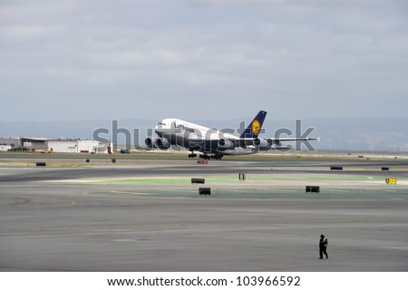 SAN FRANCISCO, CA - MAY 26: A Lufthansa Airbus A380, the world\'s largest passenger jet, takes off in San Francisco, CA on May 26, 2012. The A380 has recently experienced cracks in its wings.