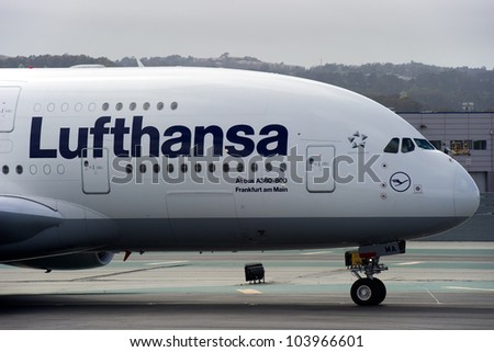 SAN FRANCISCO, CA - MAY 26: A Lufthansa Airbus A380, the world\'s largest passenger jet, taxis in San Francisco, CA on May 26, 2012. The A380 has recently experienced cracks in its wings.