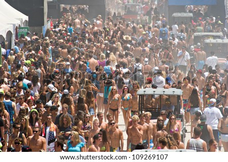 HUNTINGTON BEACH, CA - AUGUST 2: Crowds of surf fans at the Nike US Open of Surfing in Huntington Beach, CA on August 2, 2012