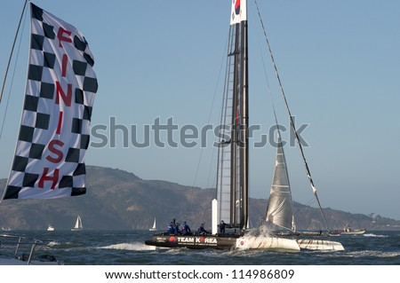 SAN FRANCISCO, CA - OCTOBER 4: Team Korea skippered by Peter Burling crosses the finish line in the America\'??s Cup World Series sailing races in San Francisco, CA on October 4, 2012