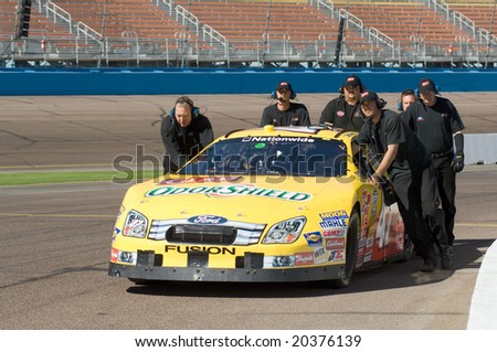 AVONDALE, AZ - NOV 7 -  Kelly Bires\' (47) pit crew pushes his car at the NASCAR Nationwide Series race at the Phoenix International Raceway on November 7, 2008 in Avondale, Arizona.
