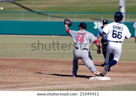 MESA, AZ - NOV 20: Will Rhymes of the Mesa Solar Sox beats throw to Scottsdale Scorpions first baseman Mark Trumbo in the Arizona Fall League game on November 20, 2008 in Mesa, Arizona