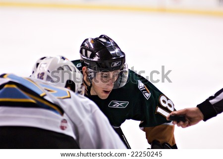 PHOENIX, AZ - DECEMBER 18: Utah Grizzlies forward James Sixsmith (#18) waits for the face-off during the ECHL hockey game against the Phoenix Roadrunners on December 18, 2008 in Phoenix, Arizona.