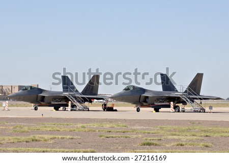 GLENDALE, AZ - MARCH 21: Two U.S. Air Force F-22 Raptor fighters parked on the runway at the biennial air show (\