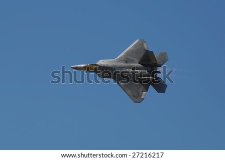 GLENDALE, AZ - MARCH 21: A U.S. Air Force F-22 Raptor makes a knife edge pass at the biennial air show (\