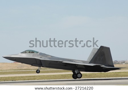GLENDALE, AZ - MARCH 21: A U.S. Air Force F-22 Raptor lands on the runway at the biennial air show (\
