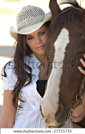 Tough times Stock-photo-young-woman-in-a-cowboy-hat-with-her-horse-27715735