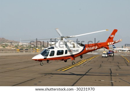 PHOENIX, AZ - MAY 13: A Phoenix police helicopter lifts off as President Barack Obama\'s motorcade arrives at Phoenix Sky Harbor Airport on May 13, 2009 in Phoenix, AZ.